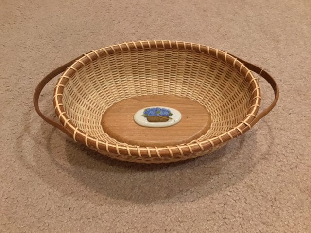 #232 11x8 with handles Corian disk with hydrangeas